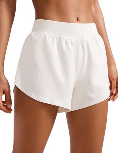 CRZ YOGA Mid Waisted Dolphin Athletic Shorts for Women 4" Lightweight High Split for Gym Workout with Liner Quick Dry Milky White (Bone) Medium